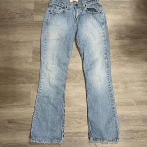 Levi's 515 Bootcut Jeans in a light-wash blue denim finish. Misses 4 short